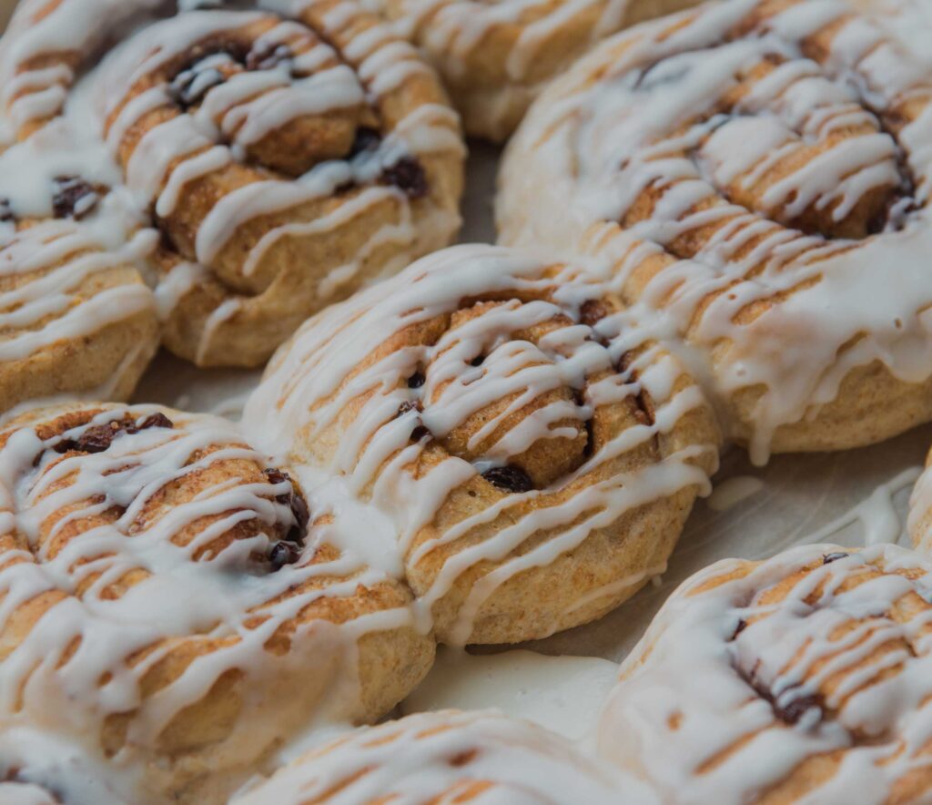 vegan-food-sweet-frosted-cinnamon-buns-shutterstock_1188362539-6016x4016