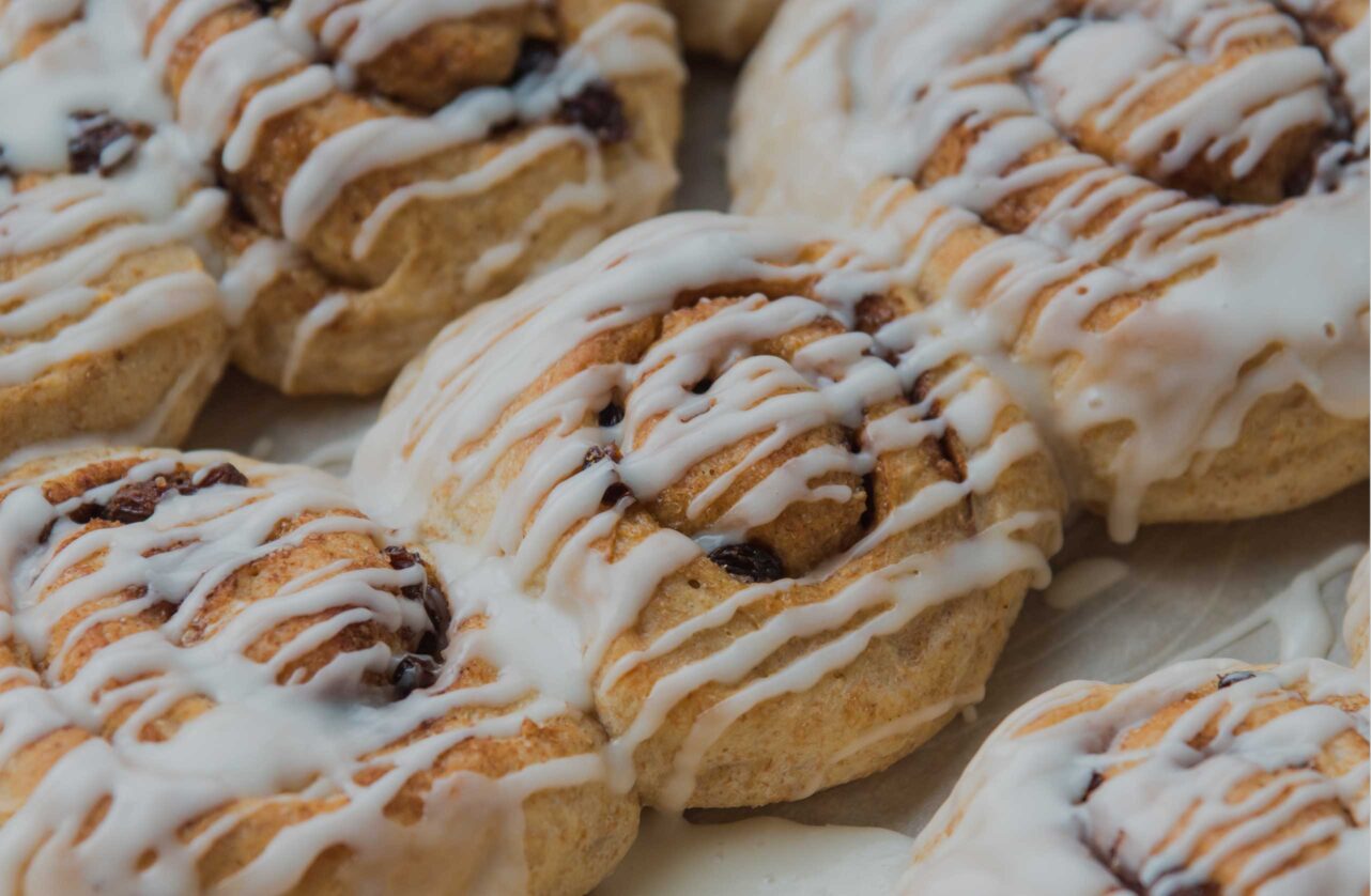 vegan-food-sweet-frosted-cinnamon-buns-shutterstock_1188362539-6016x4016