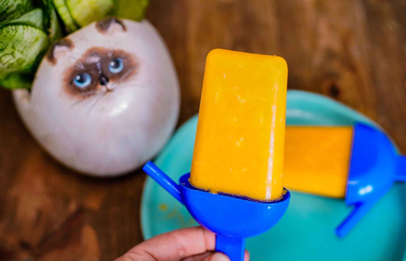 Tropical mango ice cream popsicles