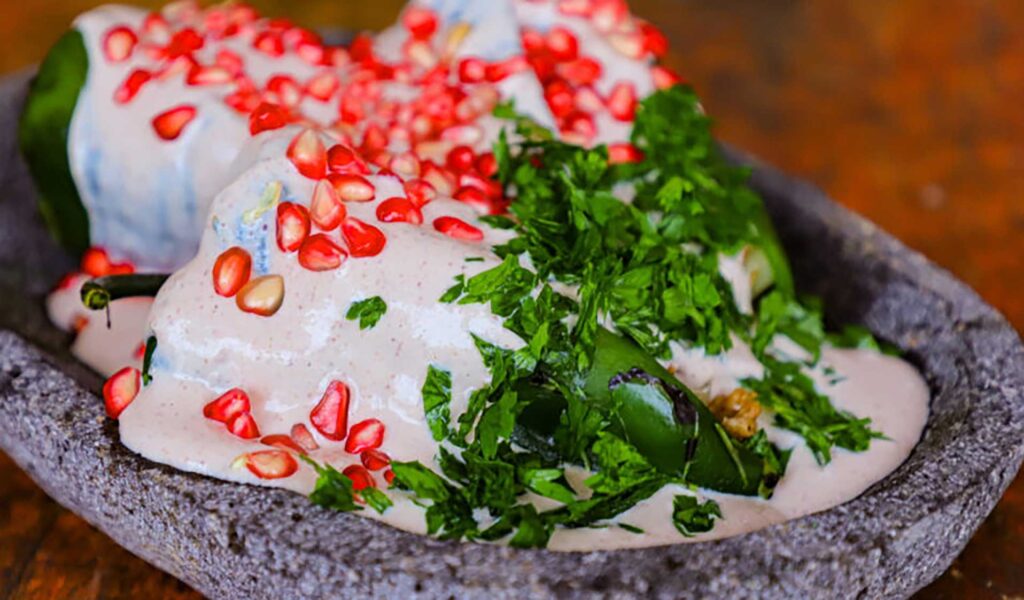 Mexican stuffed poblanos with walnut sauce